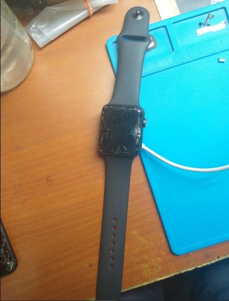 Cracked Apple Watch screen on repair workmat — Apple Watch screen repair service in Vaishali at Solutionhubtech