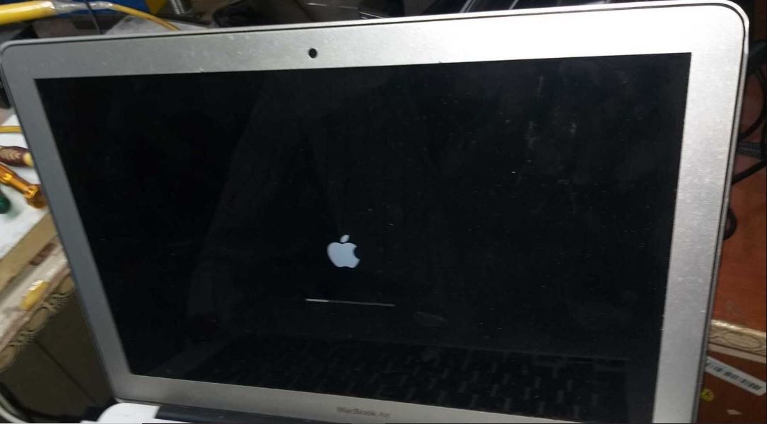 MacBook Air with black screen and Apple boot logo — MacBook Air startup failure diagnosis and repair in Vaishali at Solutionhubtech