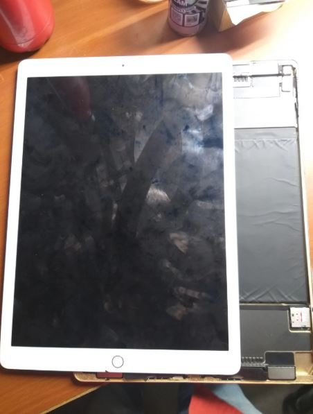 iPad Pro fully disassembled showing battery and internal components — iPad Pro repair in Vaishali at Solutionhubtech