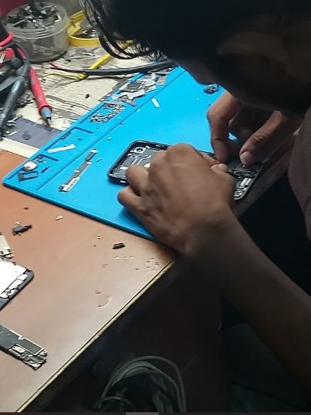 iPhone repair in progress by Solutionhubtech technician serving Indirapuram area